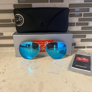 Ray-Ban Aviator Gold Frame Sunglasses with Polarized Blue Lenses.
